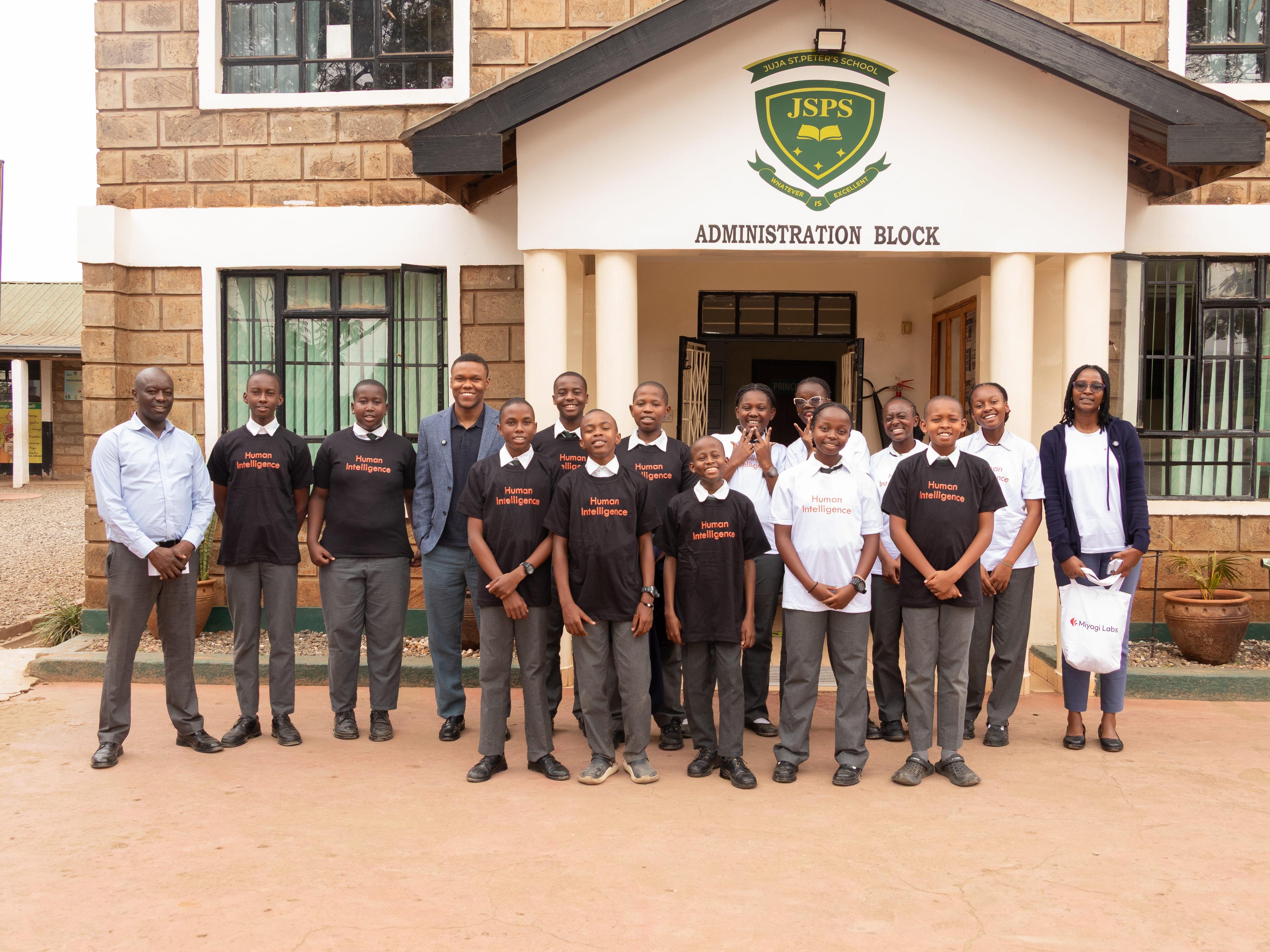 Students at Juja St. Peter's School standing with the Miyagi team outside their school.
